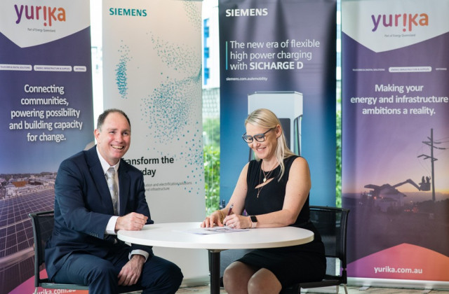 Siemens Australia Country Business Head Brett Watson signing a deal with Carly Irving, Executive General Manager at Yurika.