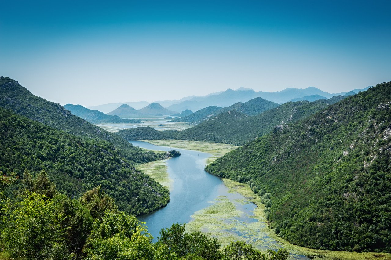 An image of Stock photo of green mountains and river.