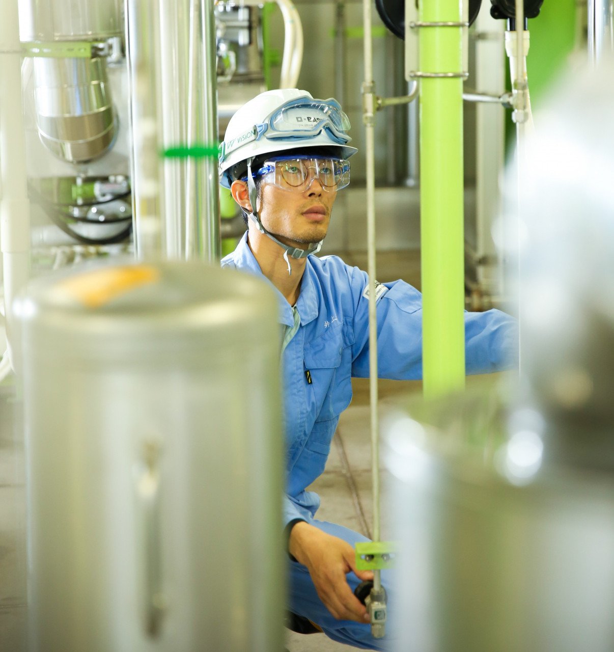 A researcher controlling the pilot-scale reactor in BTBM, Japan. Image Source: BASF.